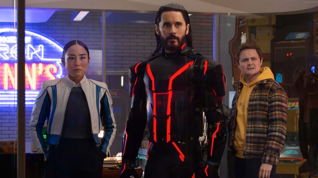 Greta Lee as Eve Kim, Jared Leto as Ares and Arturo Castro as Seth Flores in Tron: Ares, directed by Joachim Ronning. Photo: Leah Gallo. Copyright: Disney Enterprises, Inc. All Rights Reserved.